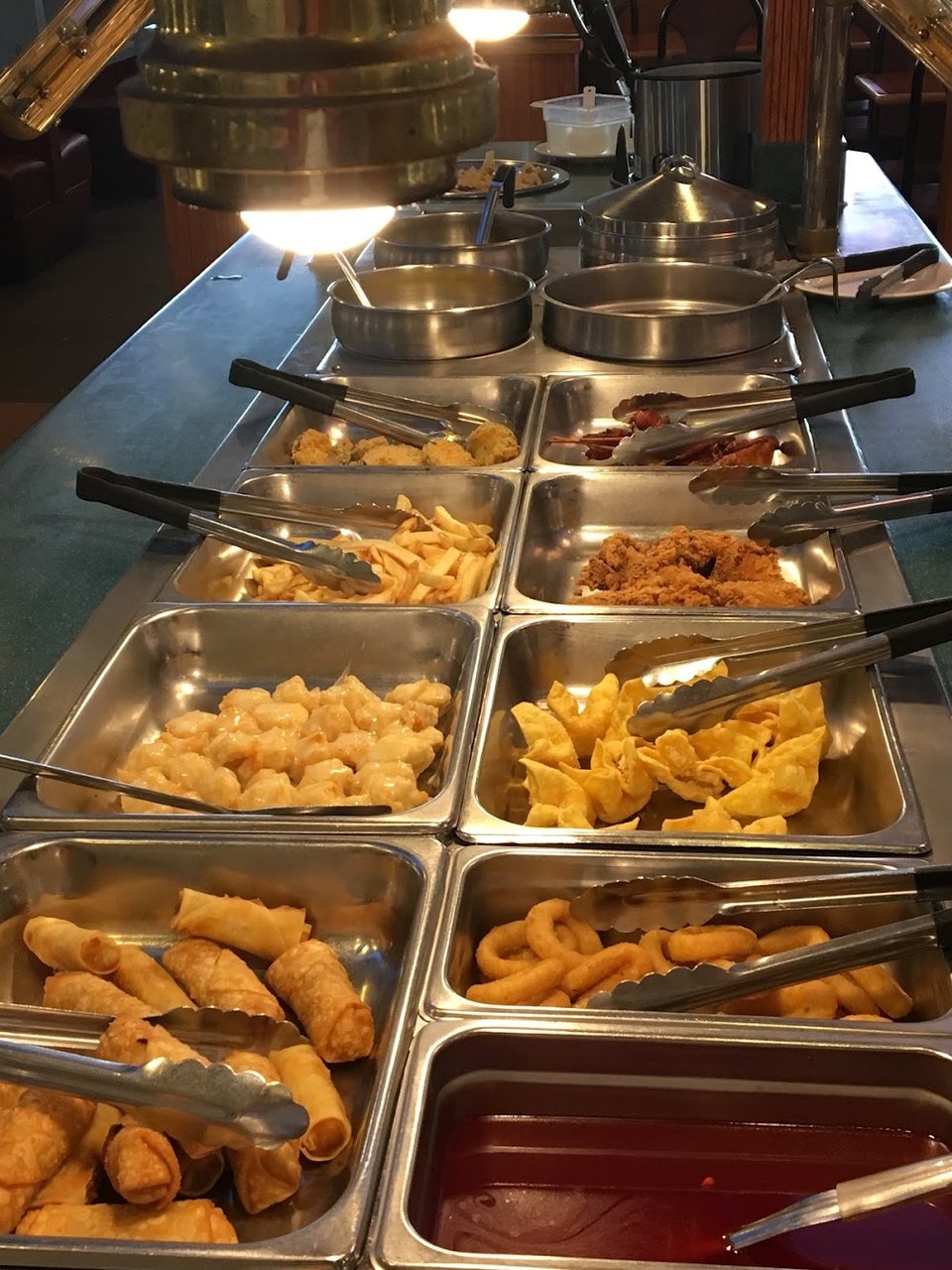 Fresh hot dishes displayed for buffet dining.