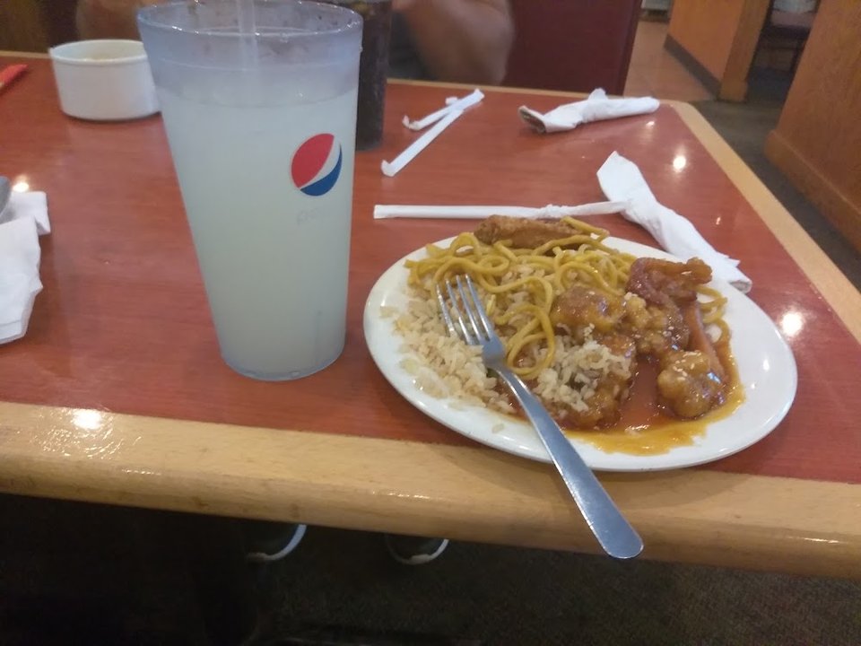 Varied Chinese dishes arranged for self-service.