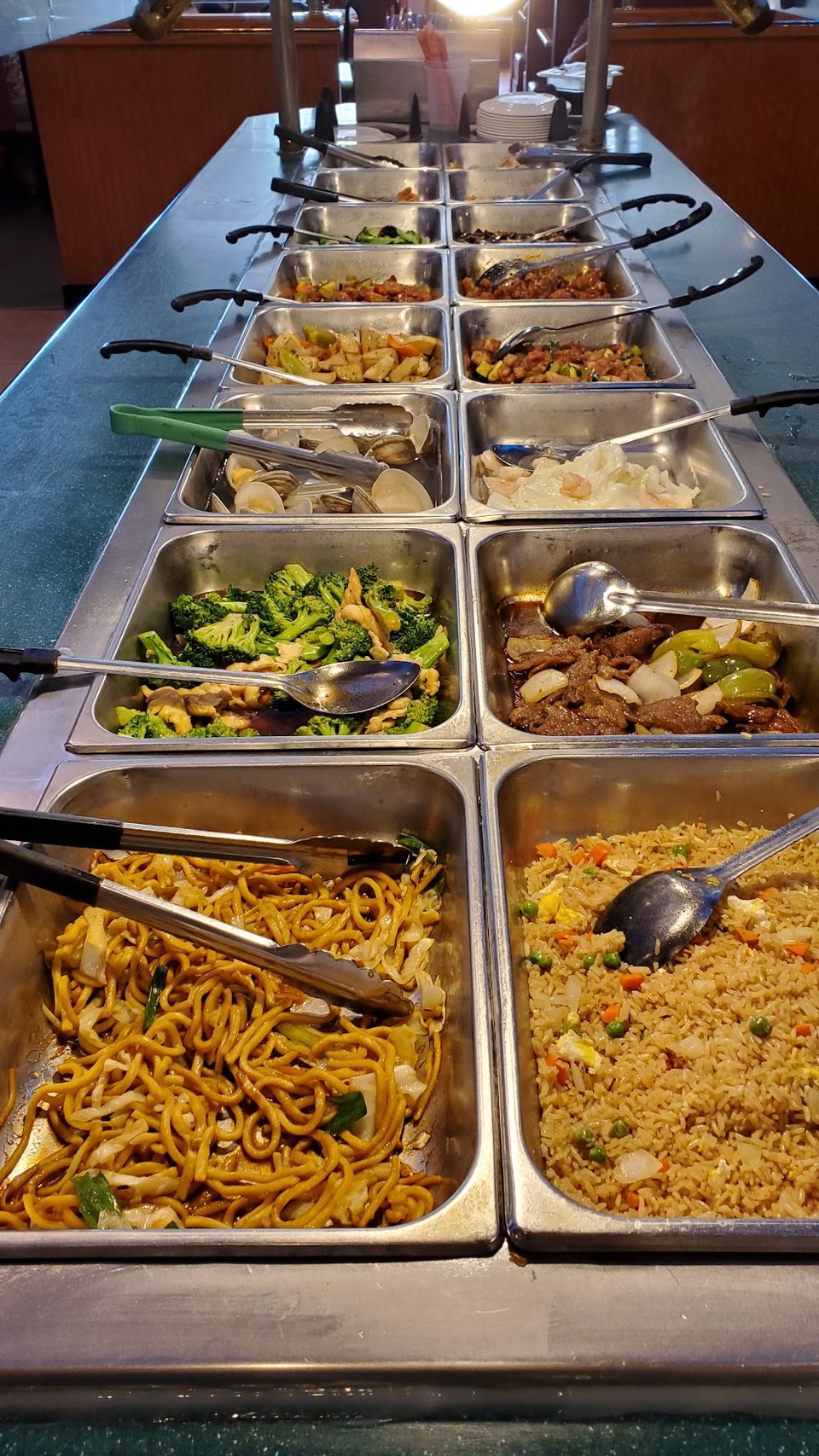 Chinese buffet dishes served in metal trays.